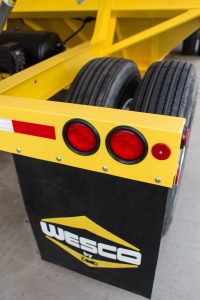 Yellow Wesco trailer with mudflap and tires